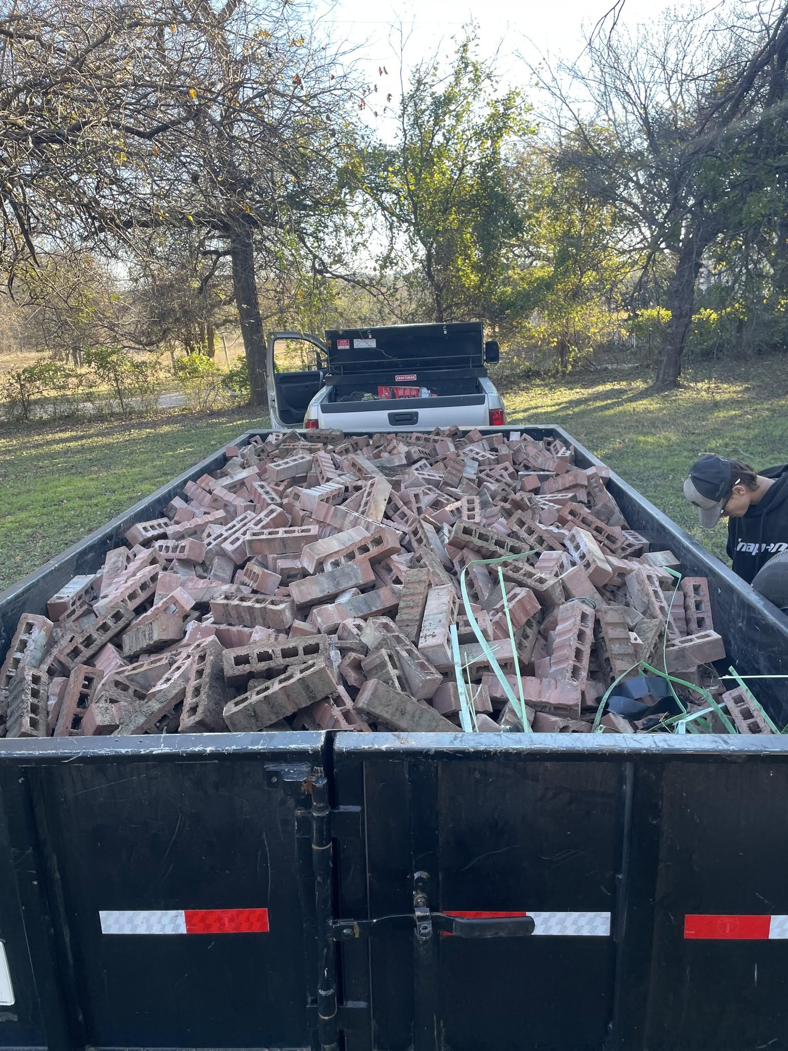 Dump trailer loaded with mulch for a local delivery