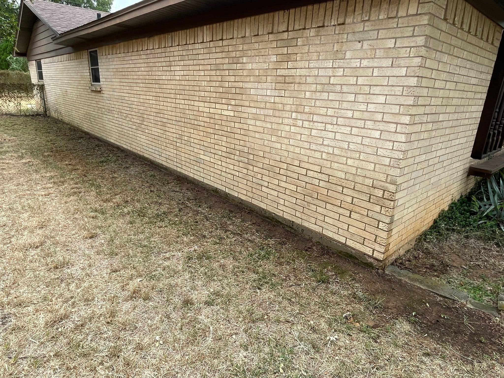 Clean brick exterior wall after pressure washing
